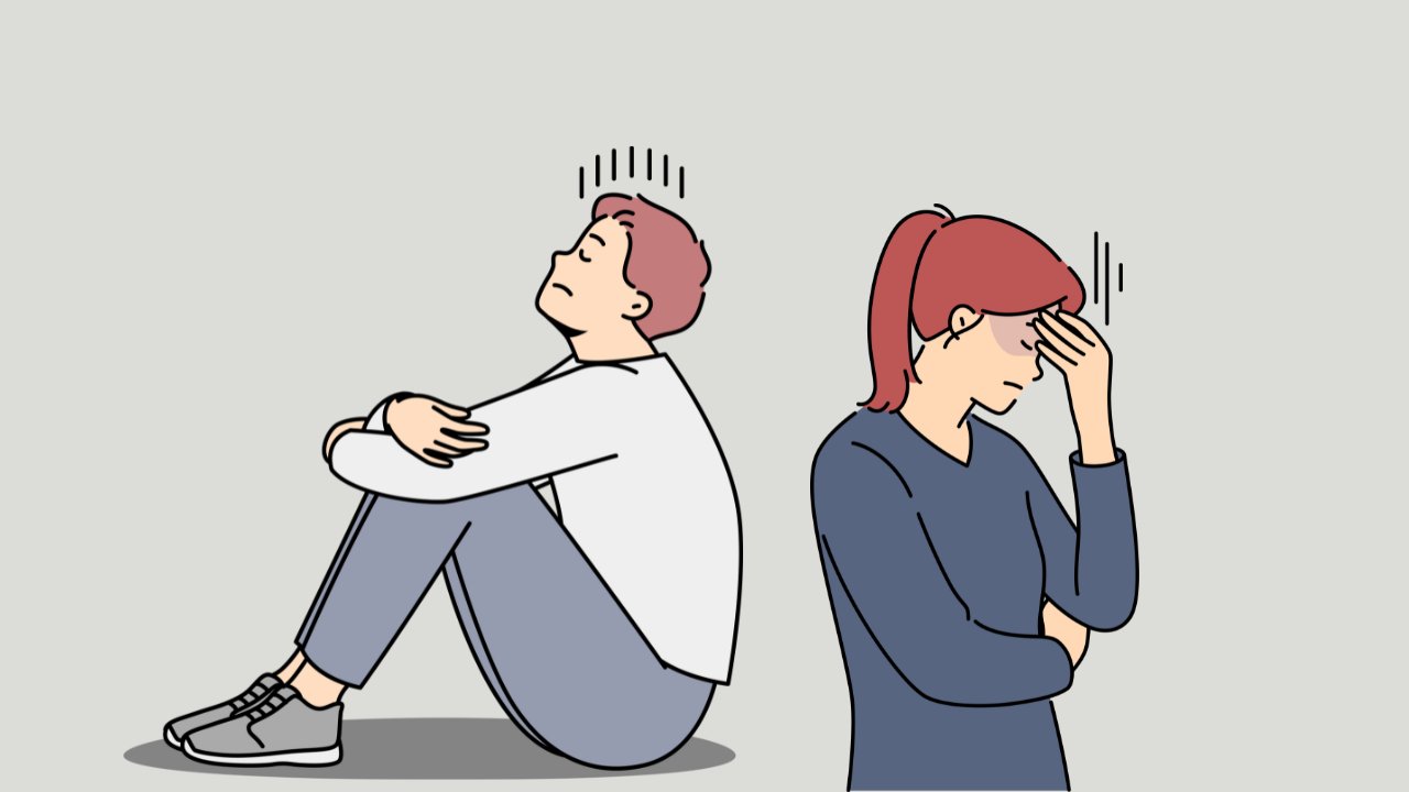 悩みを抱えて座り込む男女のイラスト